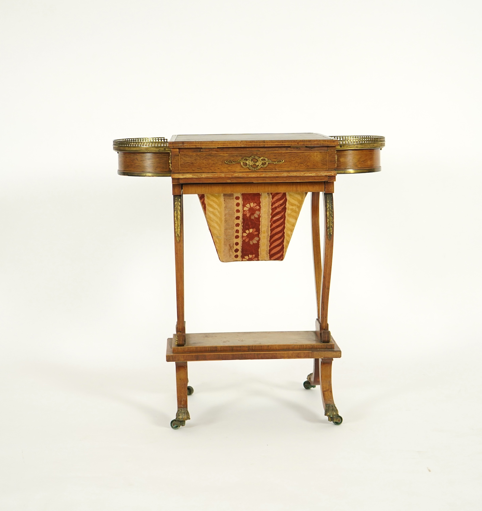 A Regency brass mounted rosewood writing, games and work table